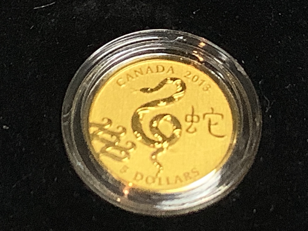 A Royal Canadian mint $5 proof pure gold coin, year of the snake, 2013, 3.13g, cased